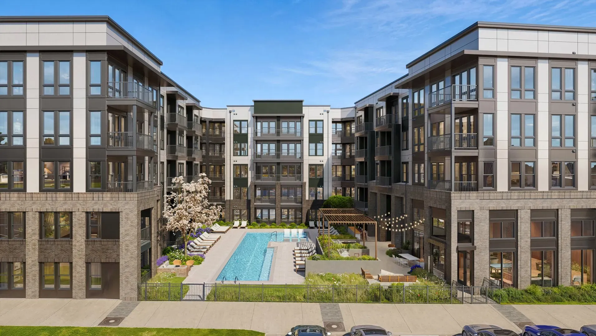 Resort-style pool courtyard with lounge chairs and a pergola at Pembroke at Friendly Center, Greensboro, NC
