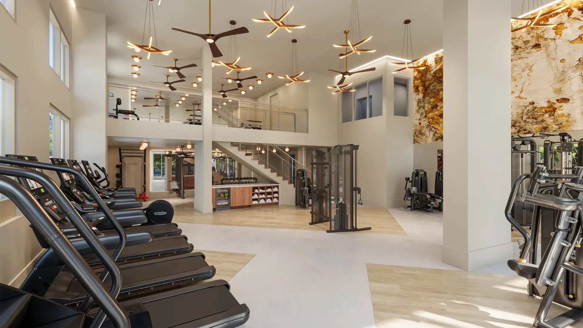Two-story fitness center with treadmills, cable machines and free weights at Pembroke, Greensboro, NC